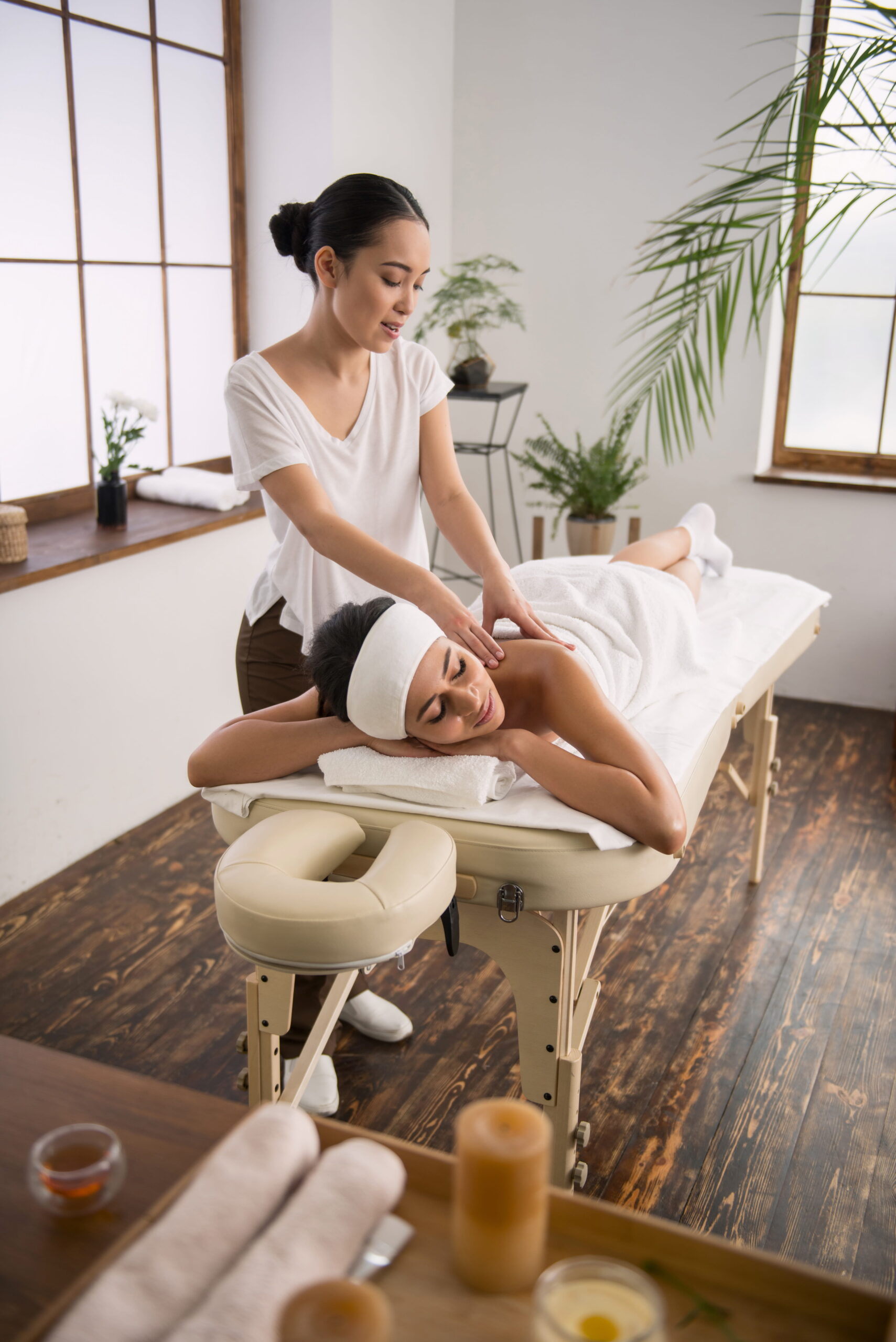 pleasurable time happy relaxed woman resting spa salon while enjoying her massage 2 scaled